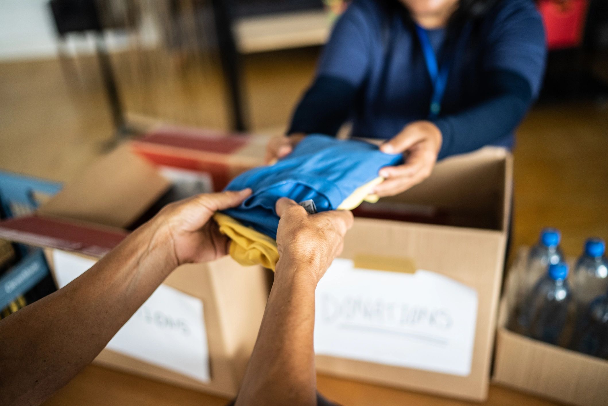 volunteers giving clothing charity
